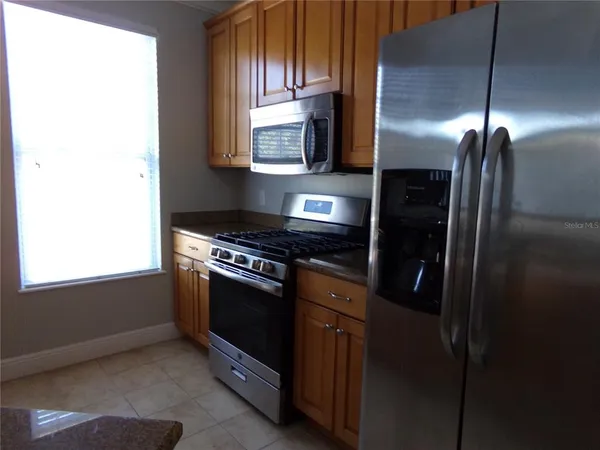 a kitchen that has a sink and a stove