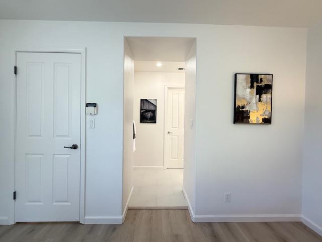 9639 Camassia Way San Ramon, CA 94582 - Photo 33 of 67 a view of a hallway with wooden floor and closet