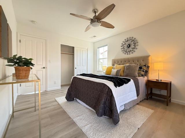 9639 Camassia Way San Ramon, CA 94582 - Photo 47 of 67 a spacious bedroom with a bed and a chandelier