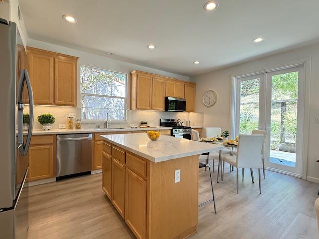 9639 Camassia Way San Ramon, CA 94582 - Photo 7 of 67 a kitchen with a stove a sink a refrigerator and a dining table