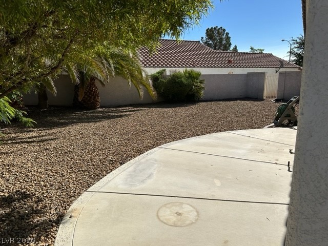 285 Spring Palms Street Henderson, NV 89012 - Photo 23 of 38 View of yard with fence and a patio area