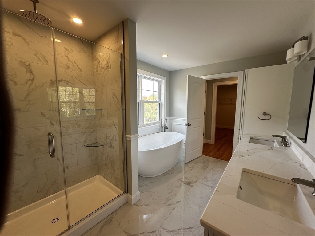 56 Dudley Road Billerica, MA 01821 - Photo 22 of 29 a bathroom with a tub shower sink and mirror
