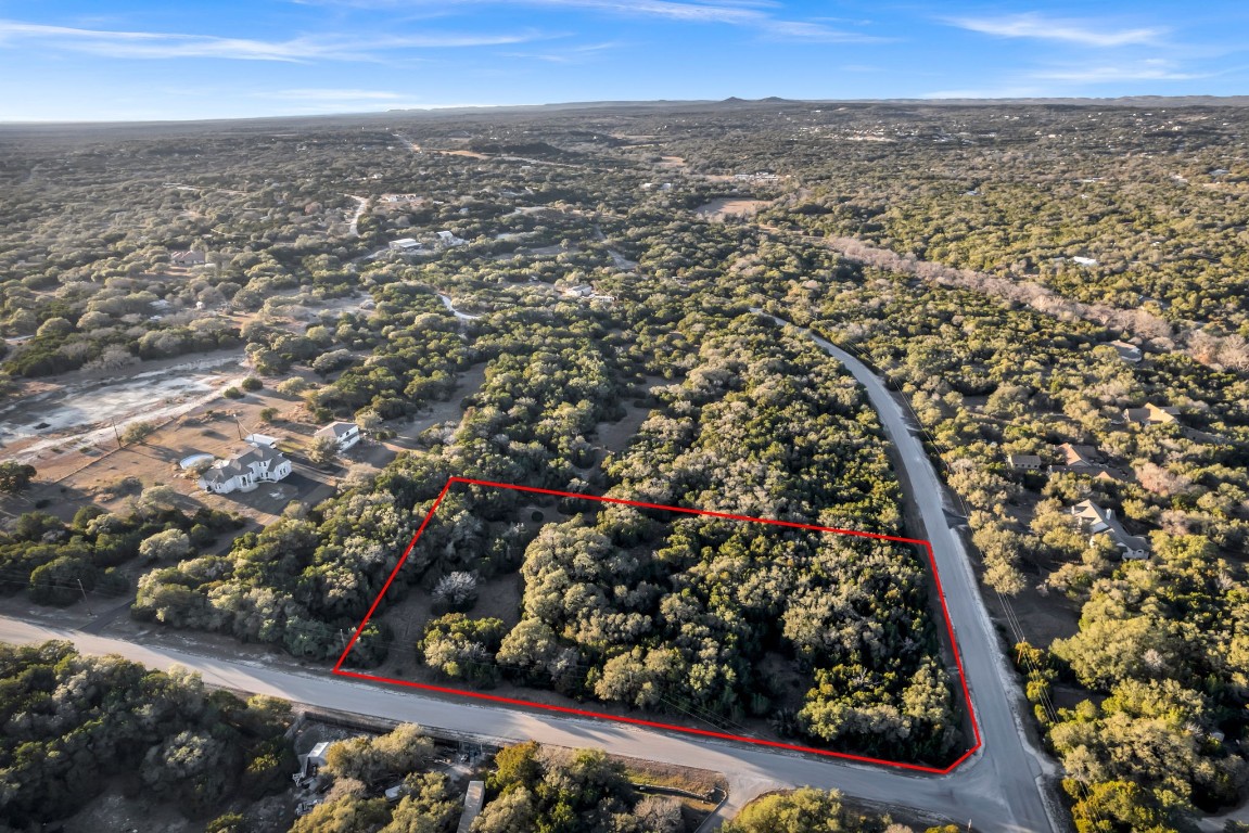 an aerial view of residential house and outdoor space