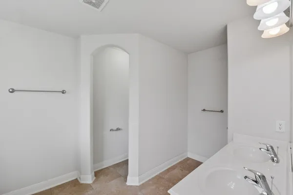 a bathroom with a sink and shower
