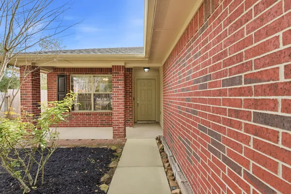 a view of a pathway both side of house