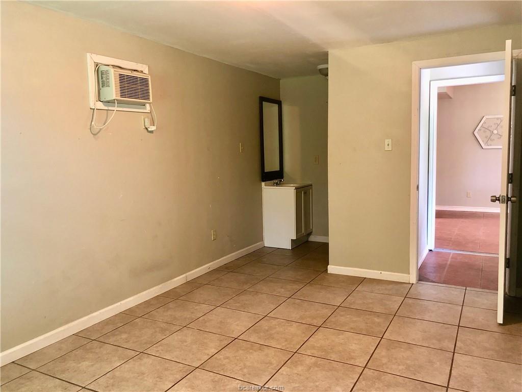 807 Vine Street Bryan, TX 77802 - Photo 10 of 17 a view of a livingroom with an empty space and a window