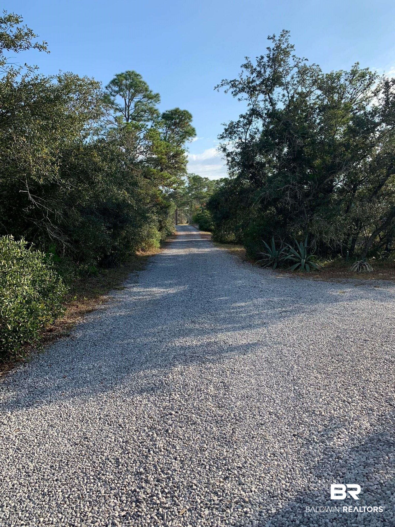 8410 H Street Gulf Shores, AL 36542 - Photo 3 of 5 Private drive that leads to the lot.