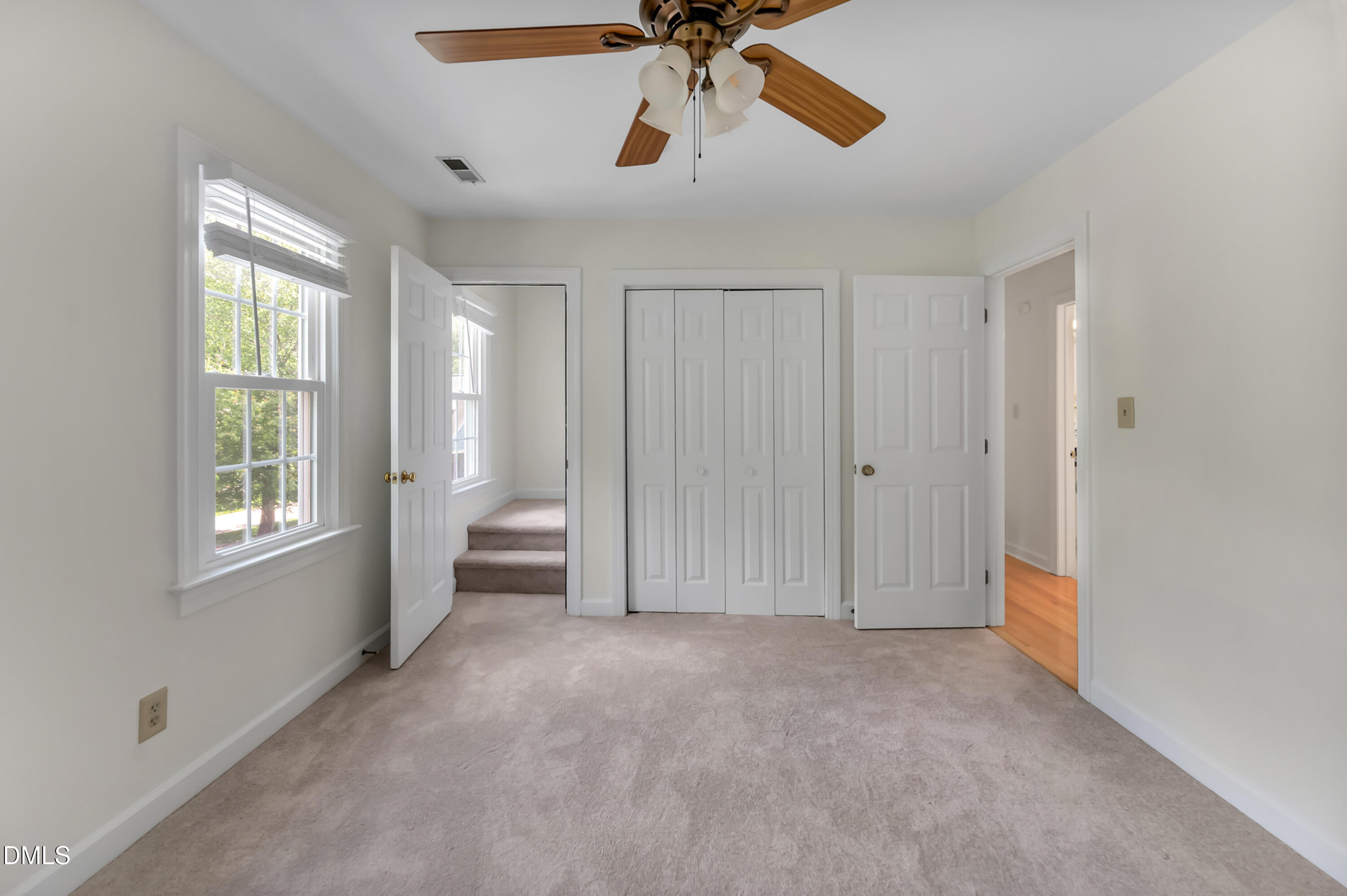 7500 Drayton Court Raleigh, NC 27615 - Photo 18 of 27 a view of empty room with windows and ceiling fan