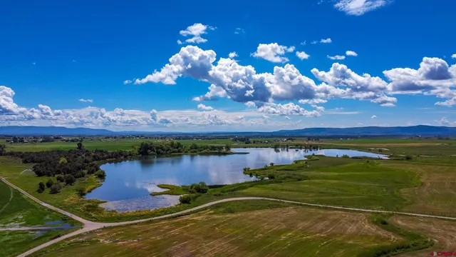 a view of a lake with a big yard
