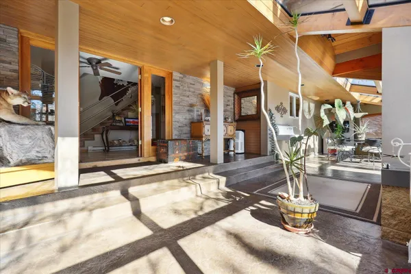 a dining room with furniture and entryway