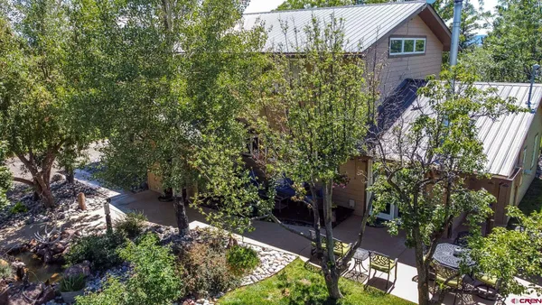a backyard of a house with lots of green space