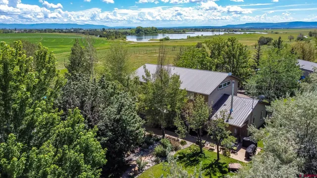 a view of a lake with a building in the background