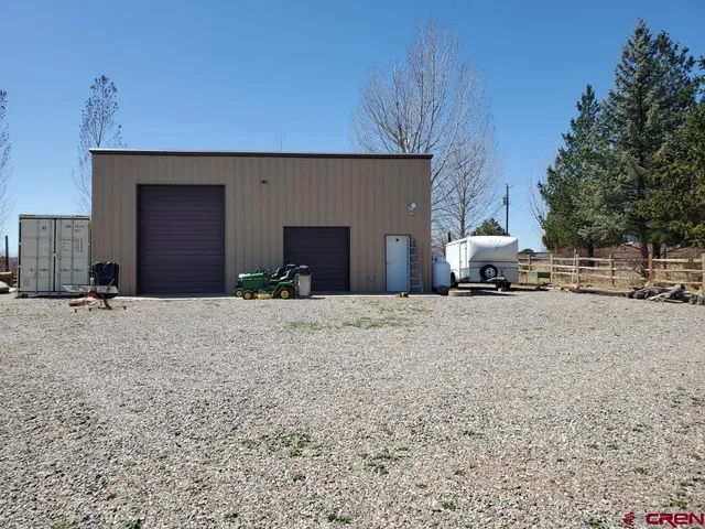 a view of building with car parked