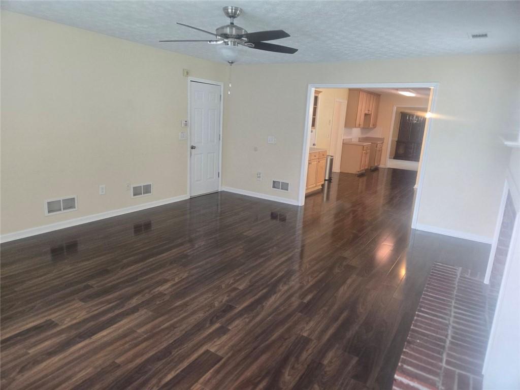 22 Windcrest Keep Covington, GA 30016 - Photo 6 of 32 wooden floor in an empty room with a window