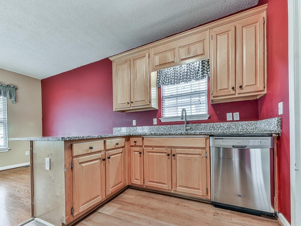 1450 Athens Avenue Southwest Atlanta, GA 30310 - Photo 13 of 35 a kitchen with granite countertop cabinets and window
