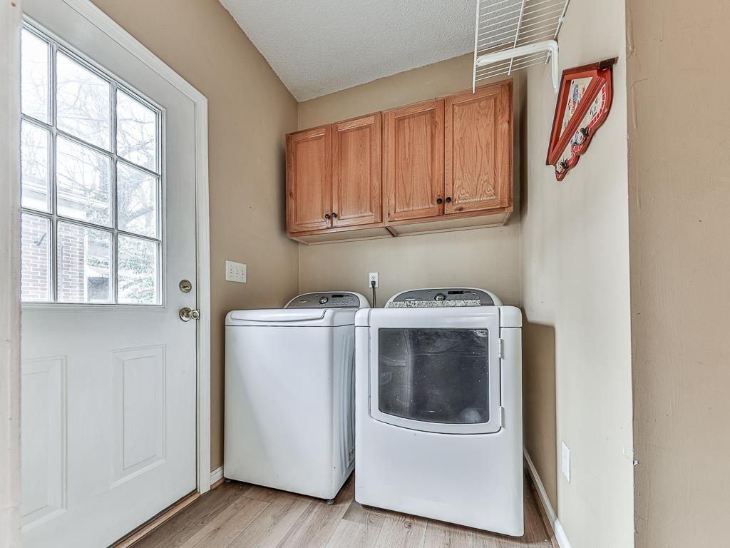 1450 Athens Avenue Southwest Atlanta, GA 30310 - Photo 14 of 35 a utility room with wooden floor washer and dryer