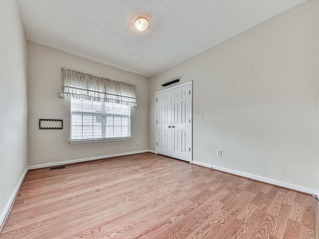 1450 Athens Avenue Southwest Atlanta, GA 30310 - Photo 17 of 35 wooden floor in an empty room with a window