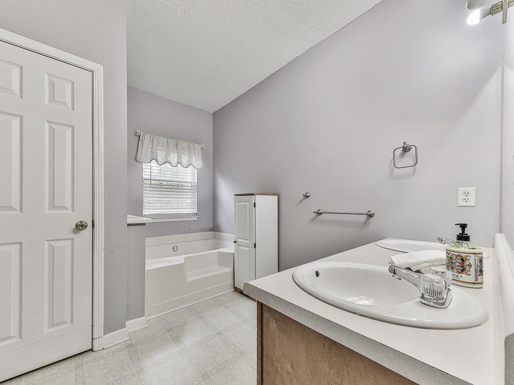 1450 Athens Avenue Southwest Atlanta, GA 30310 - Photo 22 of 35 a bathroom with a sink and a mirror