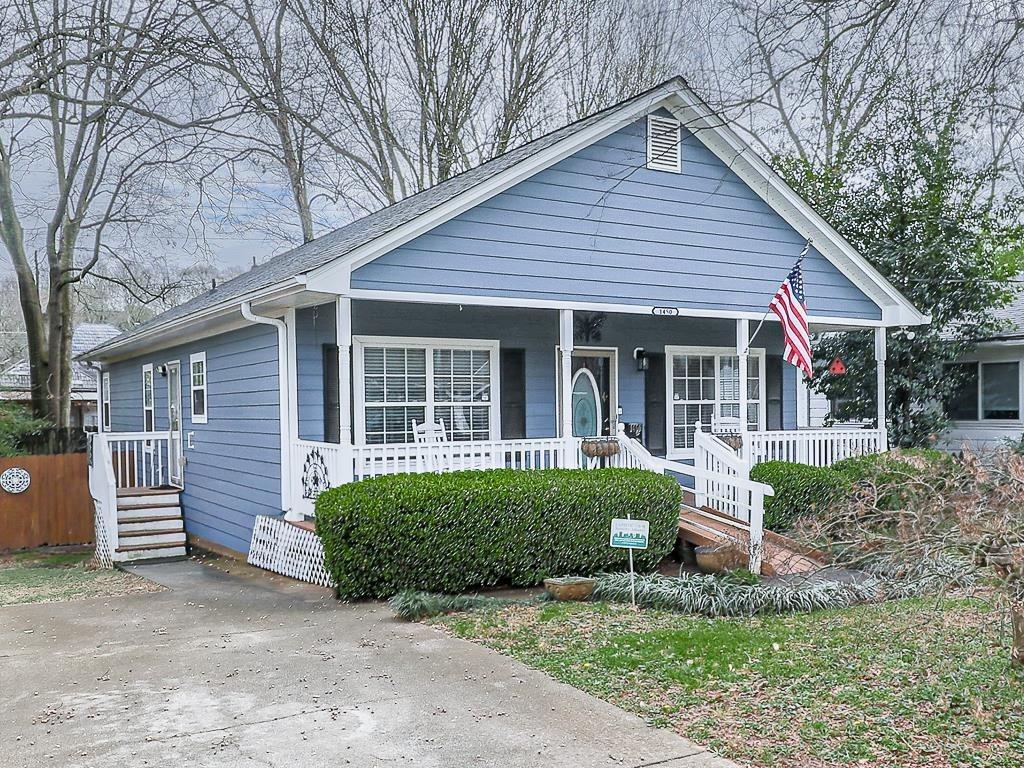 1450 Athens Avenue Southwest Atlanta, GA 30310 - Photo 30 of 35 a front view of a house with a yard and outdoor seating