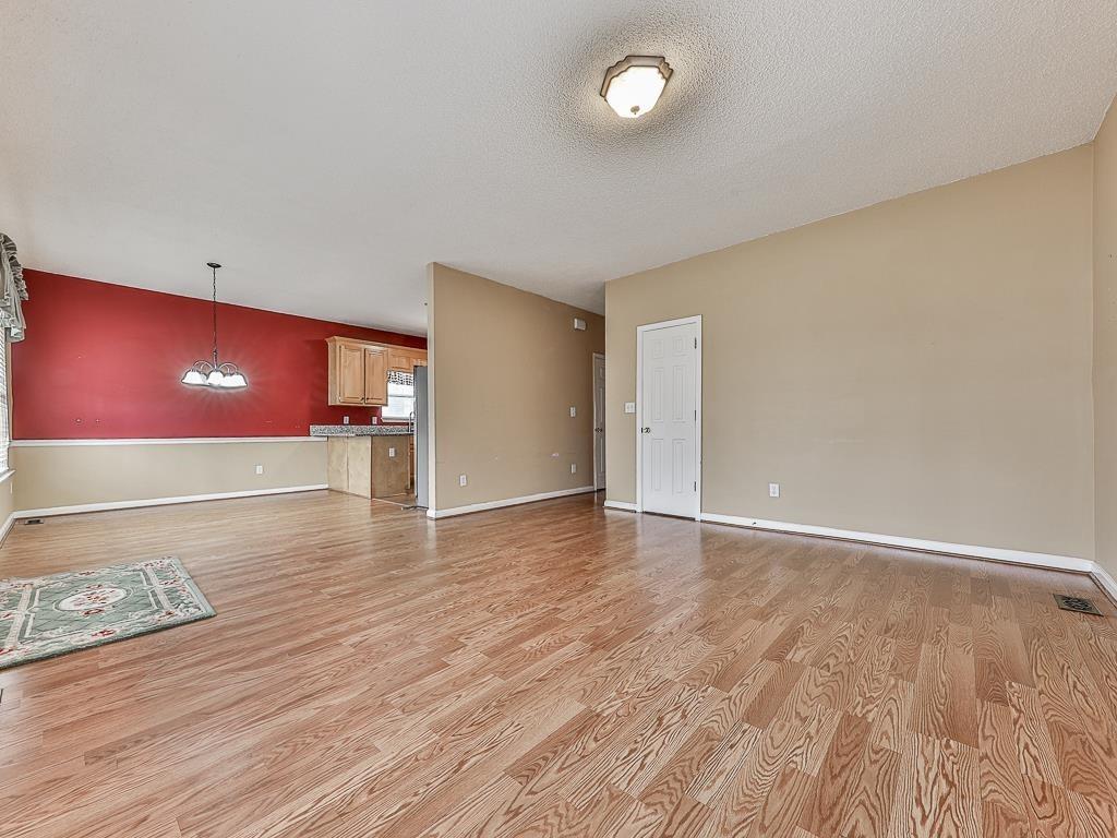 1450 Athens Avenue Southwest Atlanta, GA 30310 - Photo 3 of 35 a view of an empty room and wooden floor