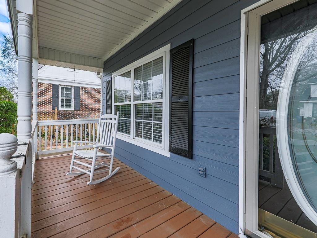 1450 Athens Avenue Southwest Atlanta, GA 30310 - Photo 32 of 35 a porch with seating space and wooden floor