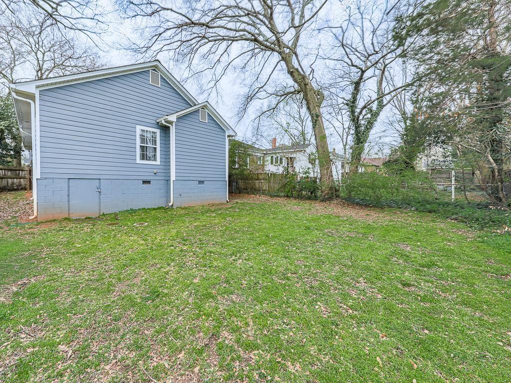 1450 Athens Avenue Southwest Atlanta, GA 30310 - Photo 35 of 35 a view of a backyard with a large tree