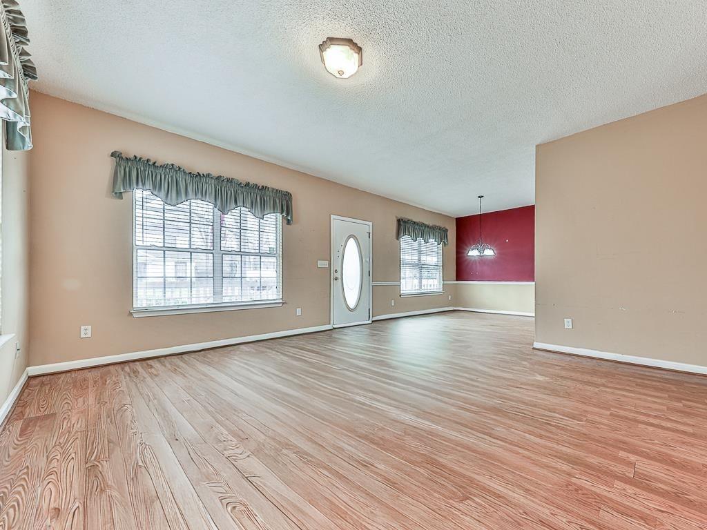 1450 Athens Avenue Southwest Atlanta, GA 30310 - Photo 4 of 35 wooden floor in an empty room with a window