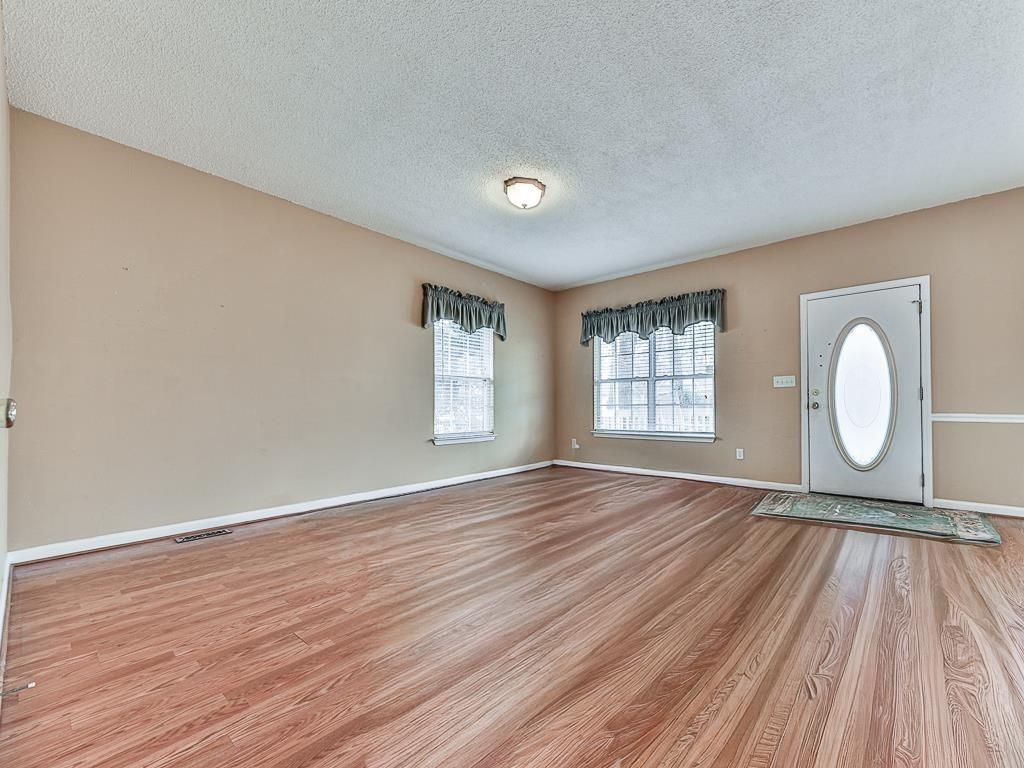 1450 Athens Avenue Southwest Atlanta, GA 30310 - Photo 6 of 35 a view of a room with wooden floor and window
