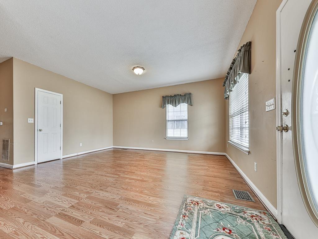 1450 Athens Avenue Southwest Atlanta, GA 30310 - Photo 7 of 35 wooden floor in an empty room with a window