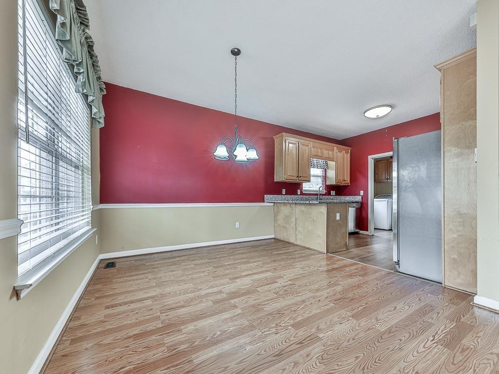 1450 Athens Avenue Southwest Atlanta, GA 30310 - Photo 9 of 35 a view of a kitchen with a refrigerator and a window