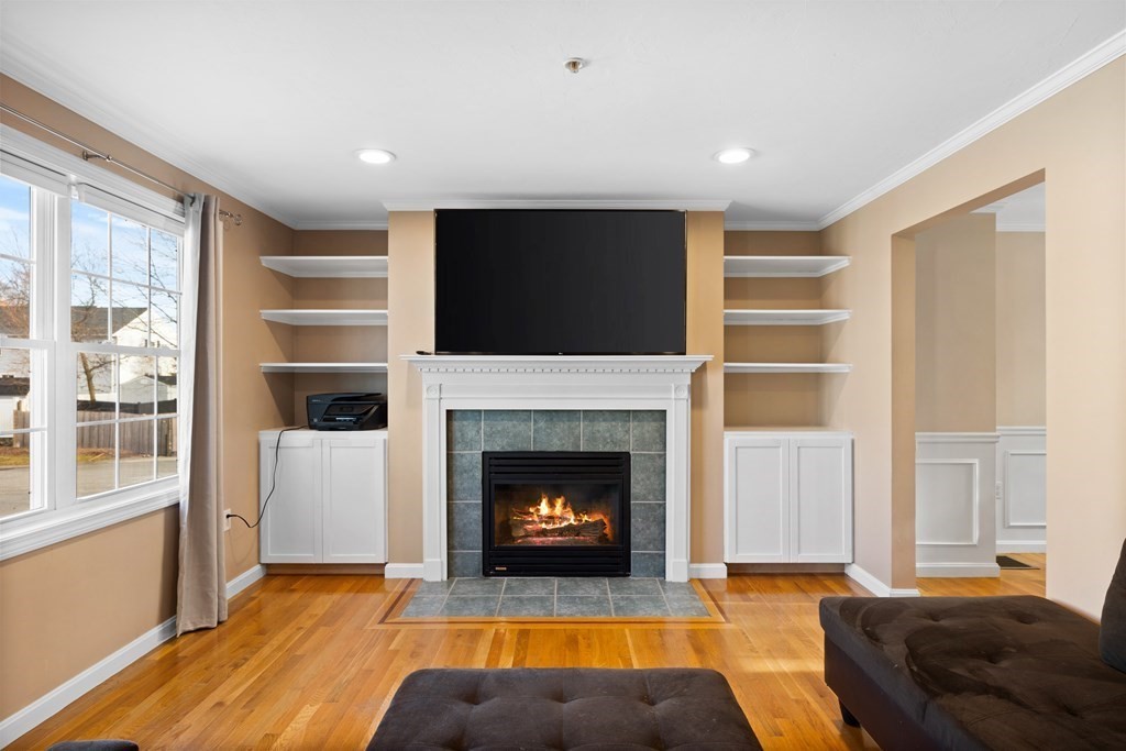 995 Trapelo Road, Unit 5 Waltham, MA 02452 - Photo 12 of 32 a living room with furniture and a fireplace