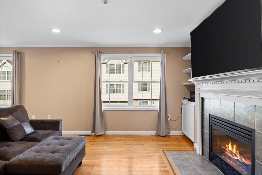 995 Trapelo Road, Unit 5 Waltham, MA 02452 - Photo 15 of 32 a living room with furniture and a fireplace