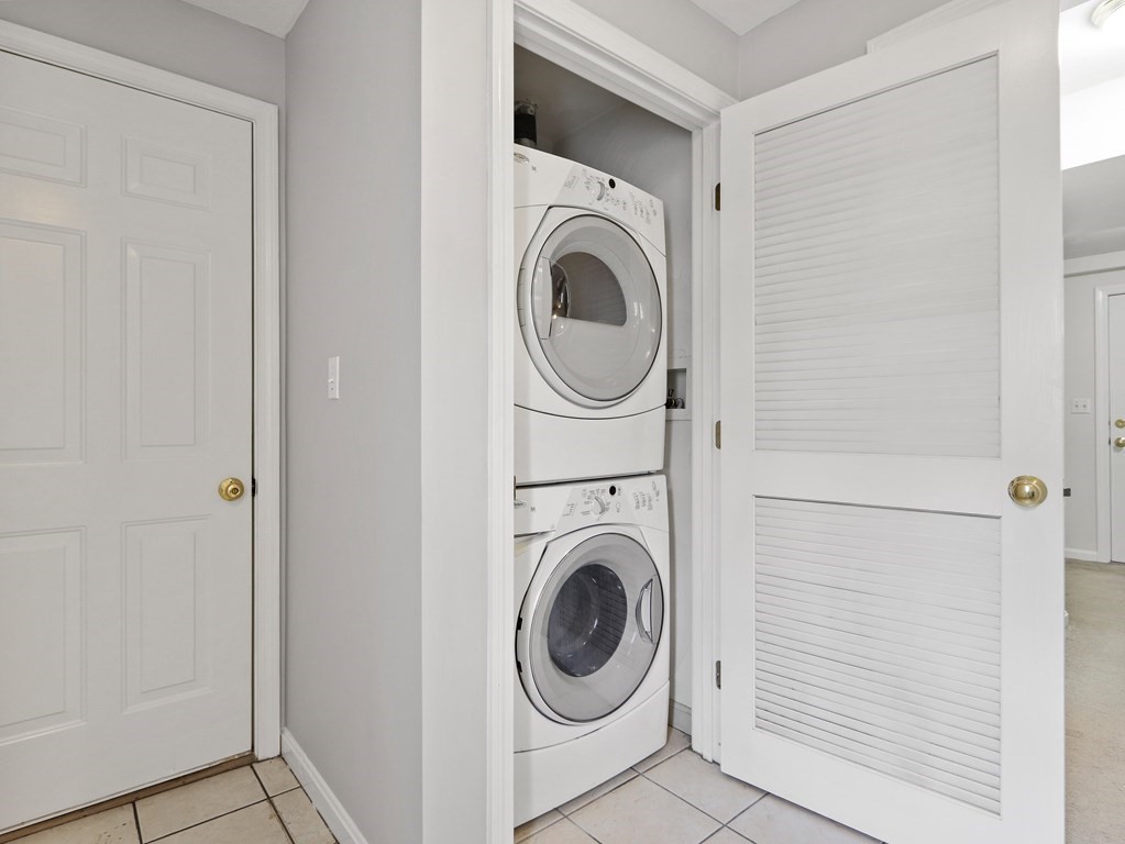 995 Trapelo Road, Unit 5 Waltham, MA 02452 - Photo 29 of 32 a utility room with dryer and washer