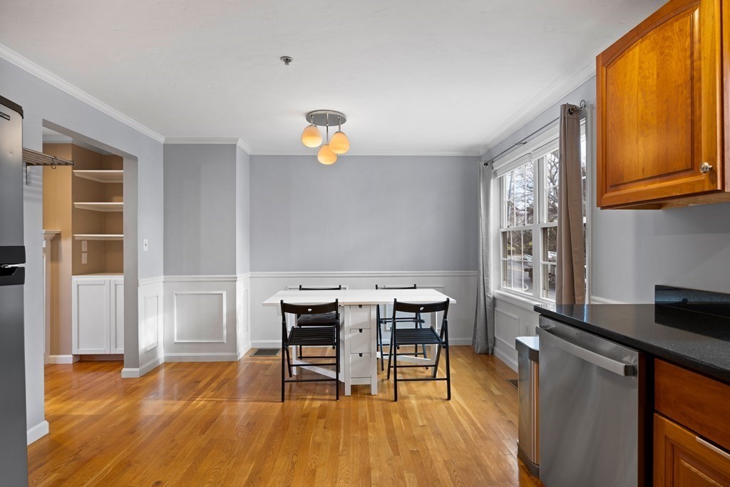 995 Trapelo Road, Unit 5 Waltham, MA 02452 - Photo 7 of 32 a view of a dining room with furniture and wooden floor