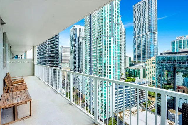 a view of balcony with floor to ceiling window and wooden floor