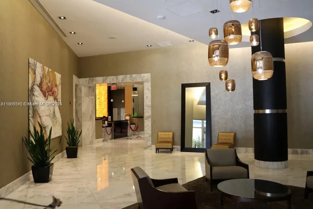 a bathroom with a sink and a potted plant