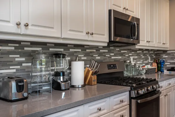 a kitchen with a stove and a microwave