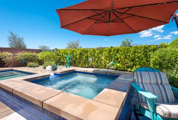 a view of swimming pool with seating space