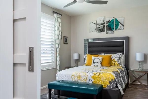 a bedroom with a bed and window