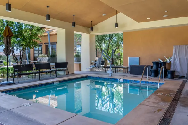 a view of swimming pool with outdoor seating and yard