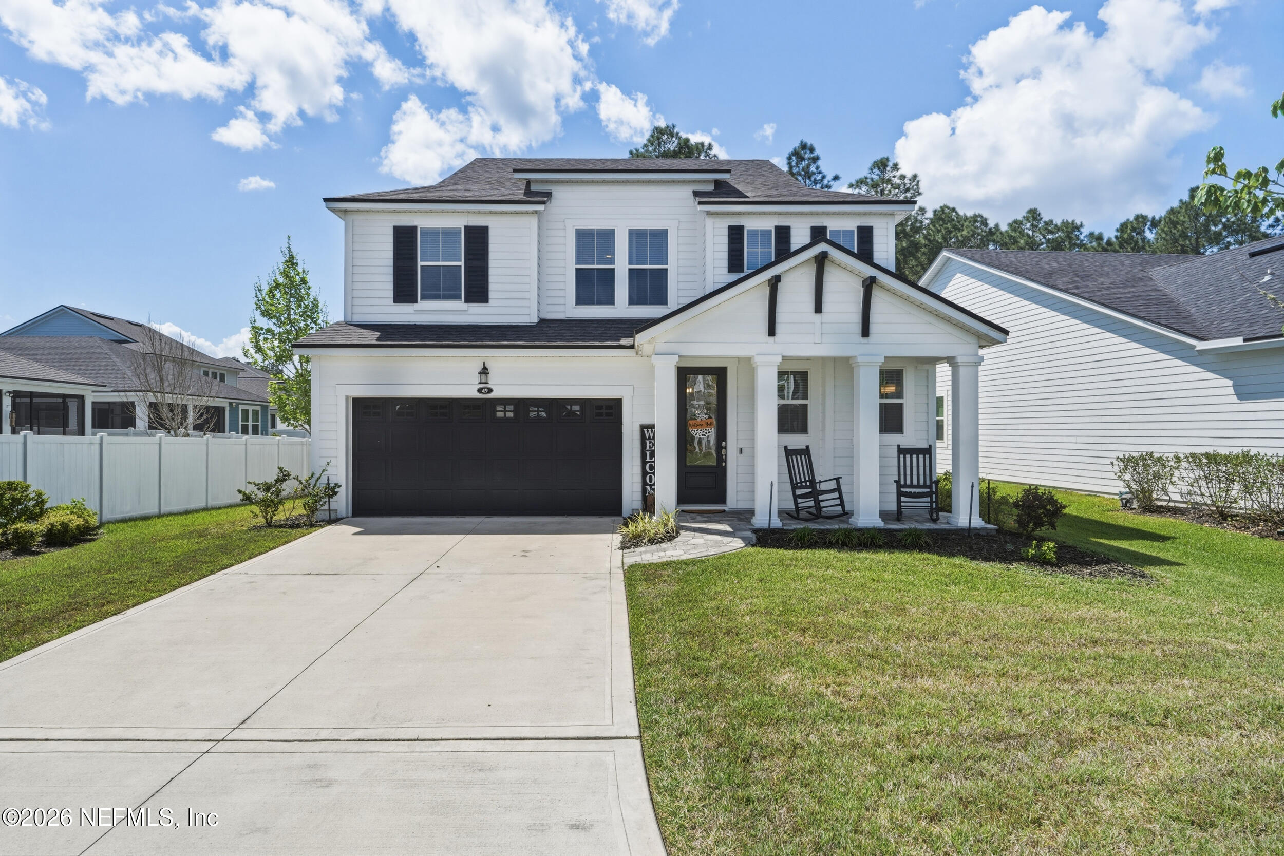 49 Oak Shadow Place St. Johns, FL 32259 - Photo 11 of 48 a front view of a house with a yard