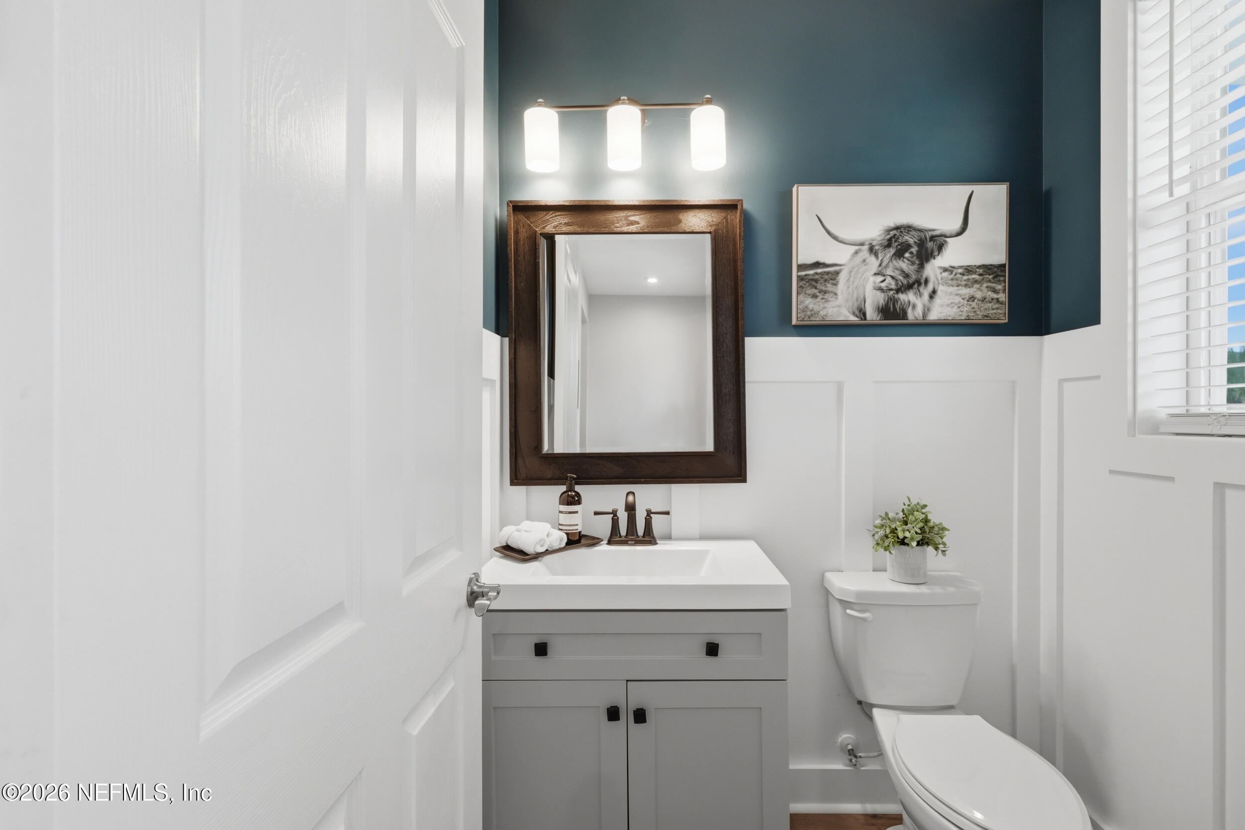 49 Oak Shadow Place St. Johns, FL 32259 - Photo 13 of 48 a bathroom with a toilet sink and mirror