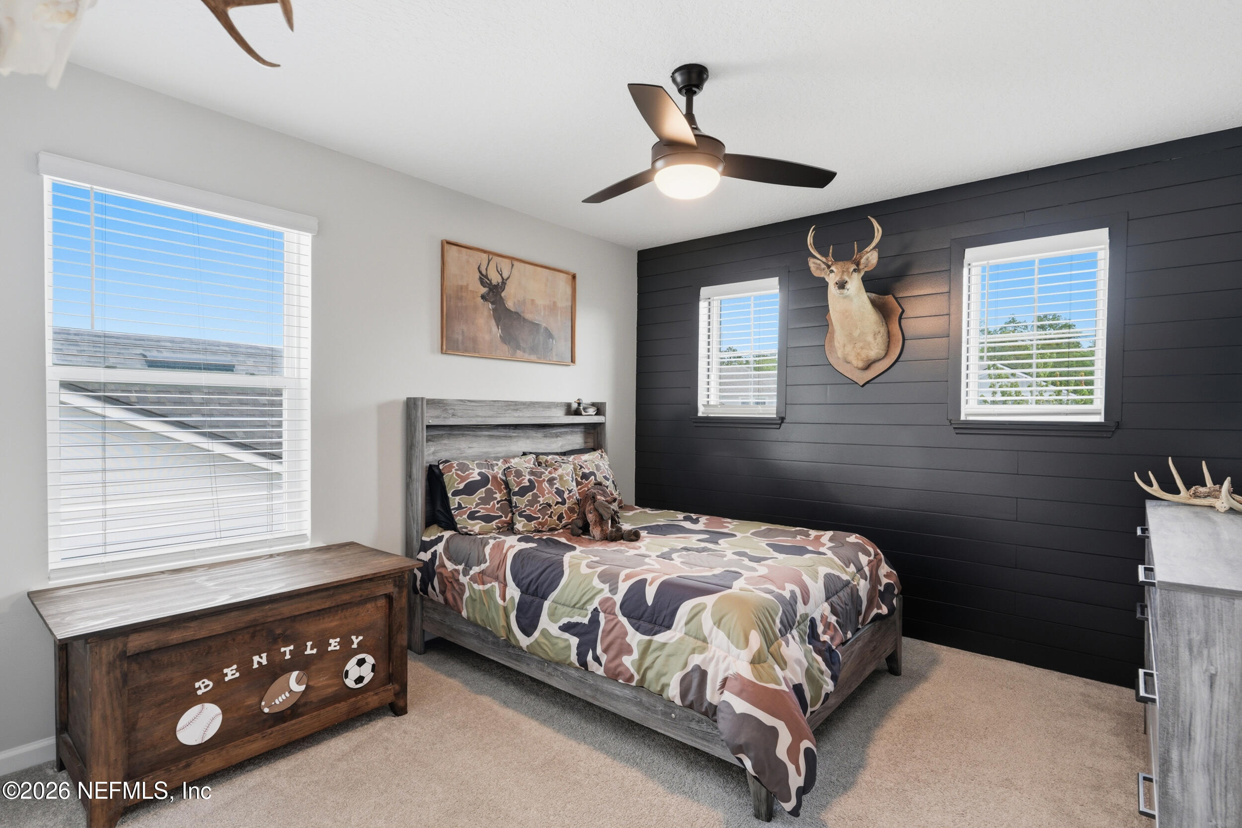 49 Oak Shadow Place St. Johns, FL 32259 - Photo 27 of 48 a bedroom with a bed and a window
