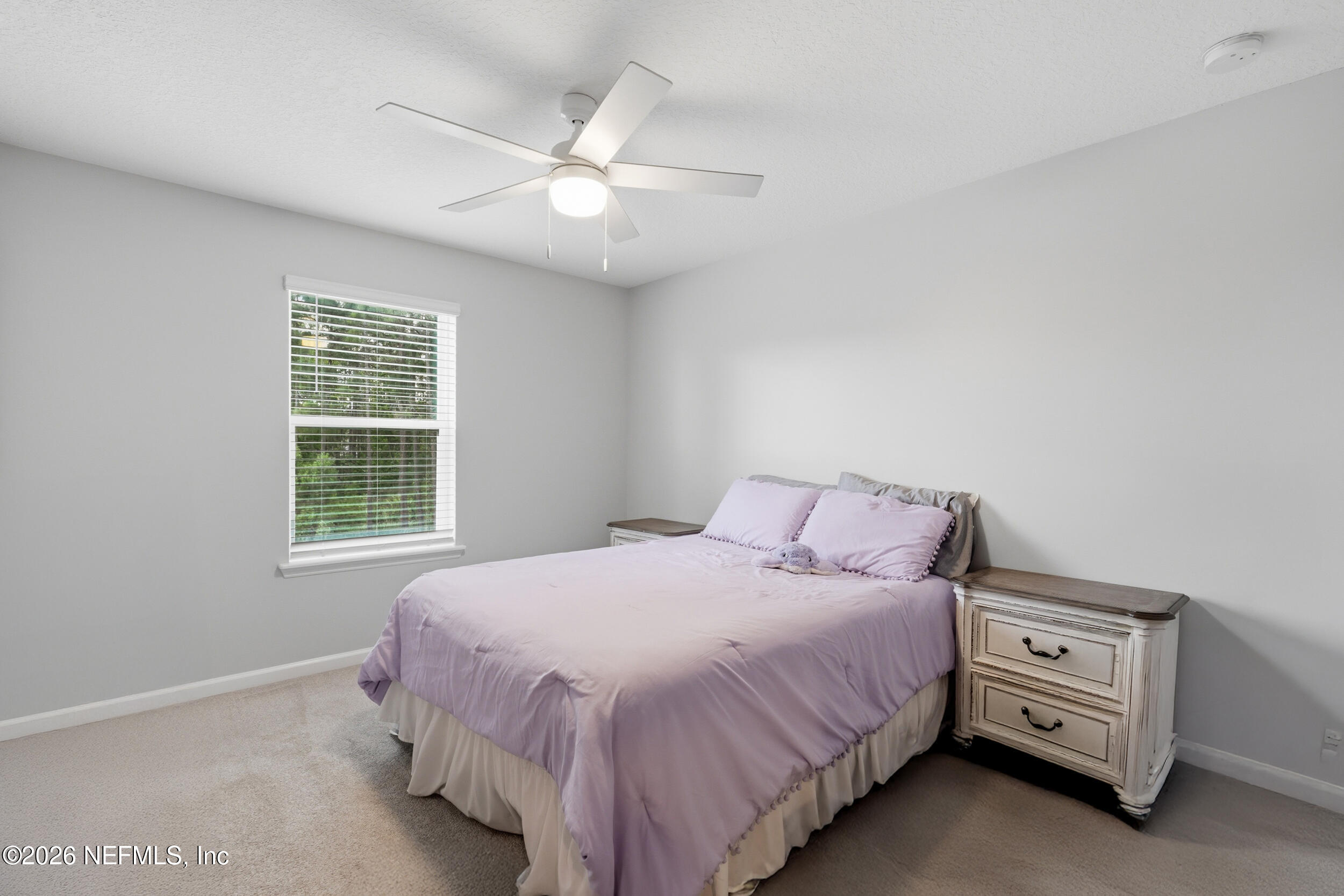 49 Oak Shadow Place St. Johns, FL 32259 - Photo 28 of 48 a bedroom with a bed and a window