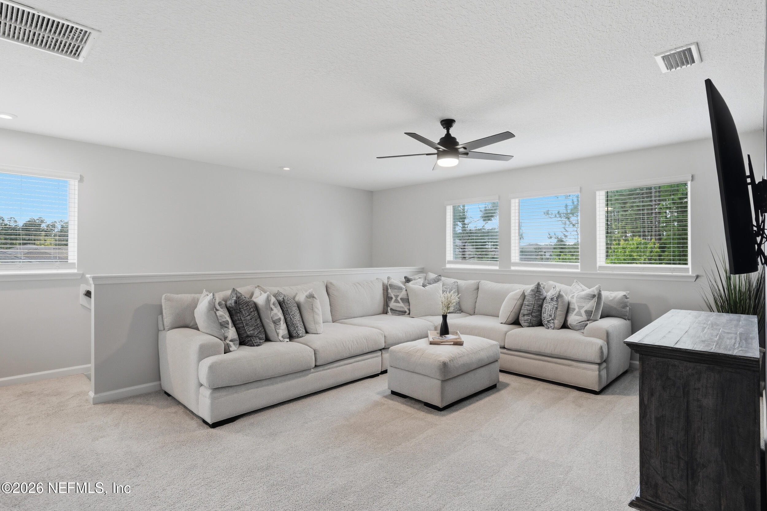 49 Oak Shadow Place St. Johns, FL 32259 - Photo 30 of 48 a living room with furniture and a large window