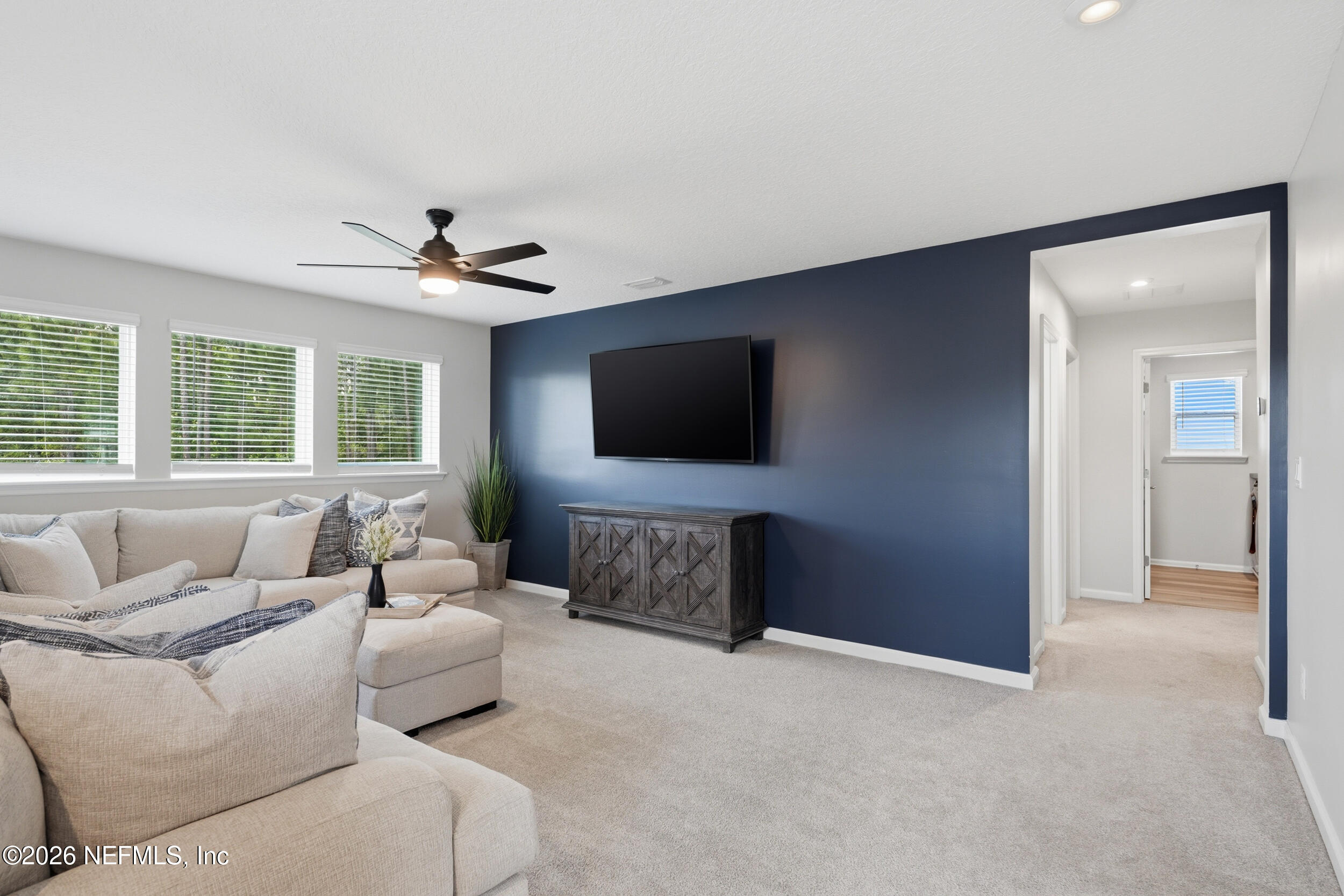 49 Oak Shadow Place St. Johns, FL 32259 - Photo 31 of 48 a living room with furniture and a flat screen tv