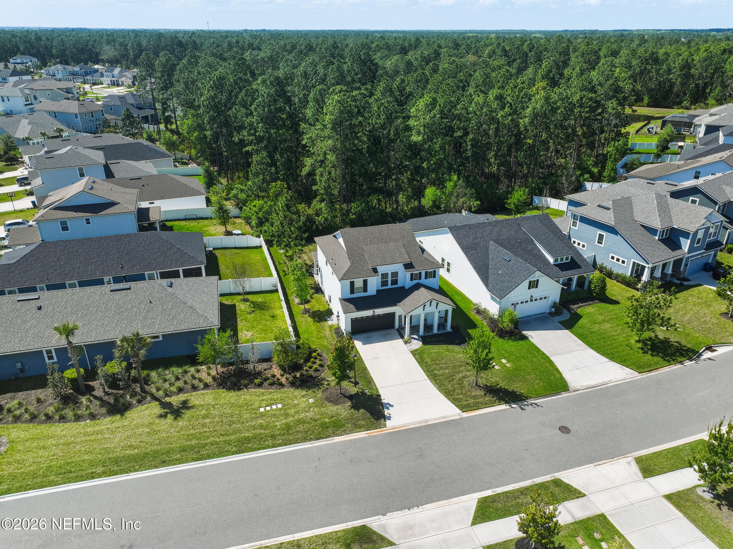 49 Oak Shadow Place St. Johns, FL 32259 - Photo 38 of 48 an aerial view of a house with a garden and lake view
