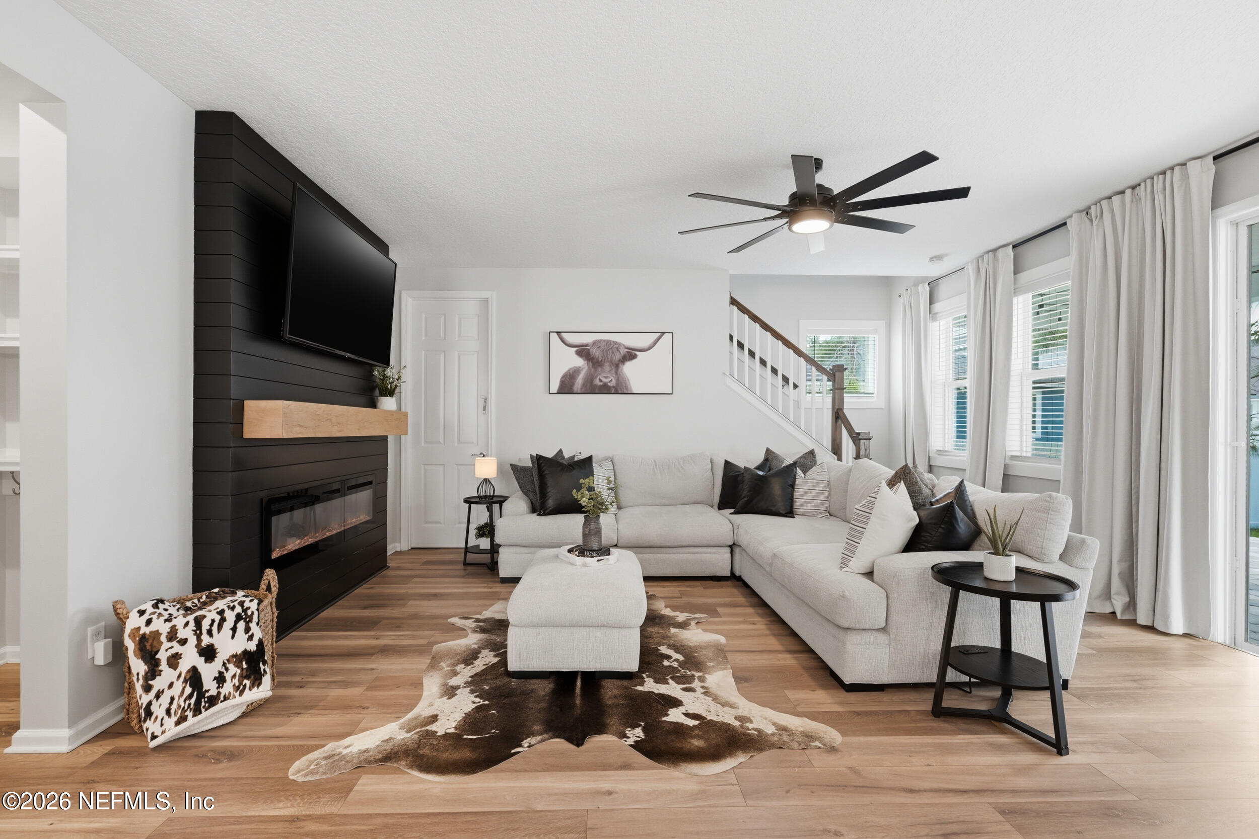 49 Oak Shadow Place St. Johns, FL 32259 - Photo 6 of 48 a living room with furniture fireplace and a flat screen tv