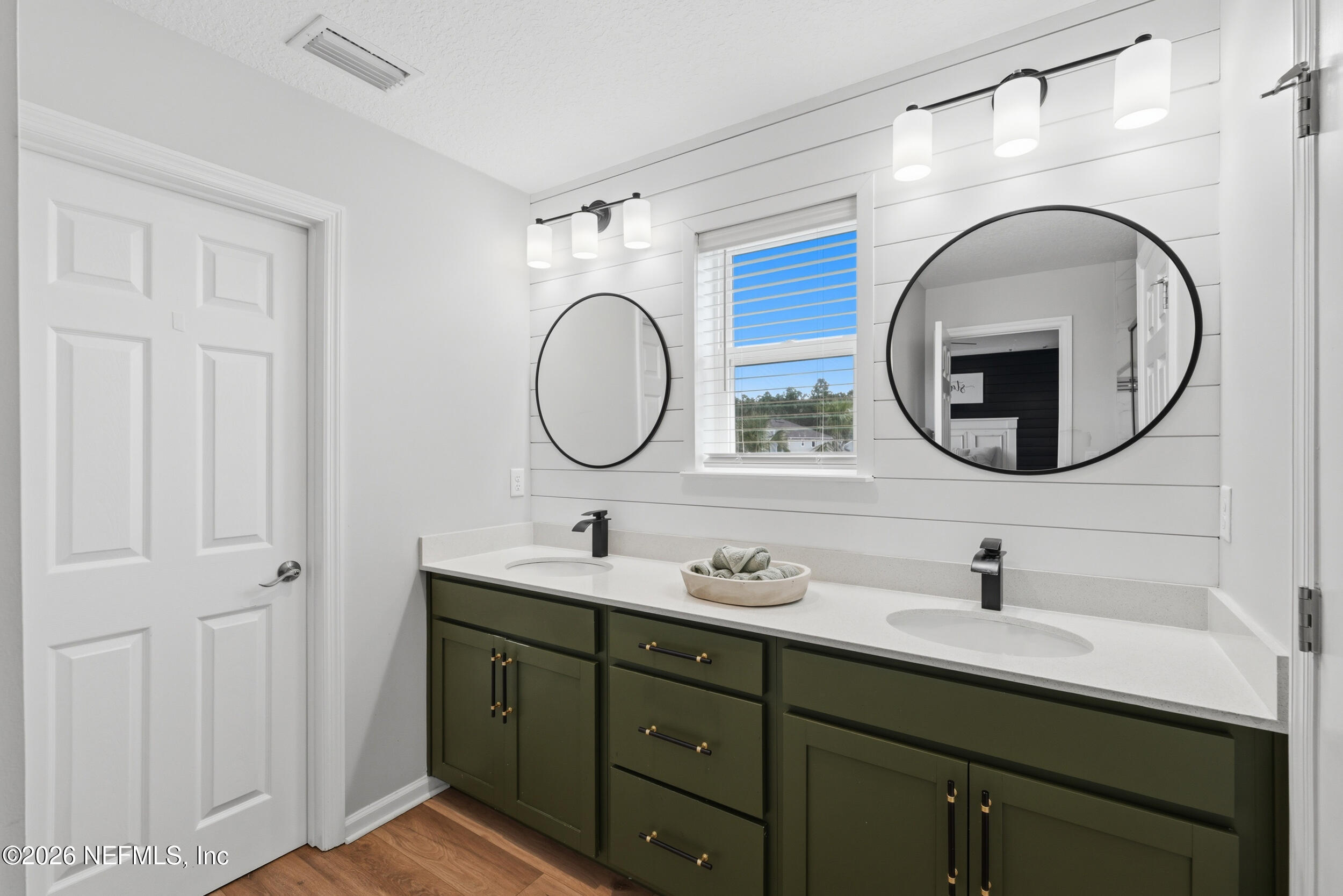 49 Oak Shadow Place St. Johns, FL 32259 - Photo 8 of 48 a bathroom with a double vanity sink and a mirror