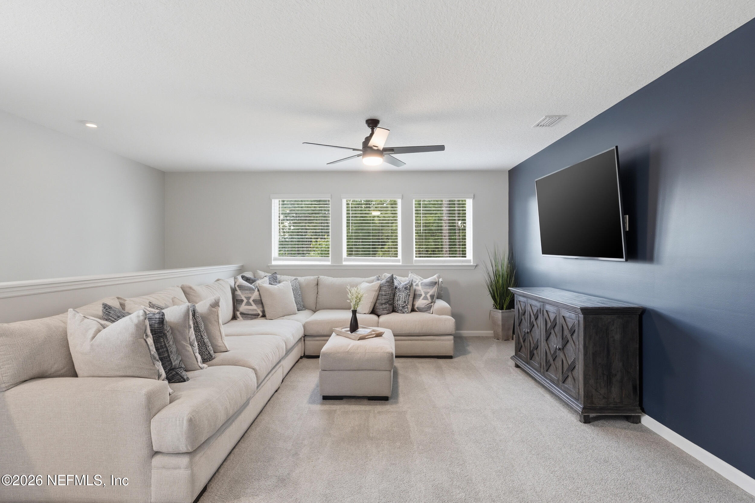 49 Oak Shadow Place St. Johns, FL 32259 - Photo 9 of 48 a living room with furniture and a flat screen tv